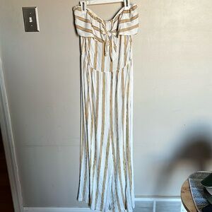 Strapless jumpsuit with gold and black strips